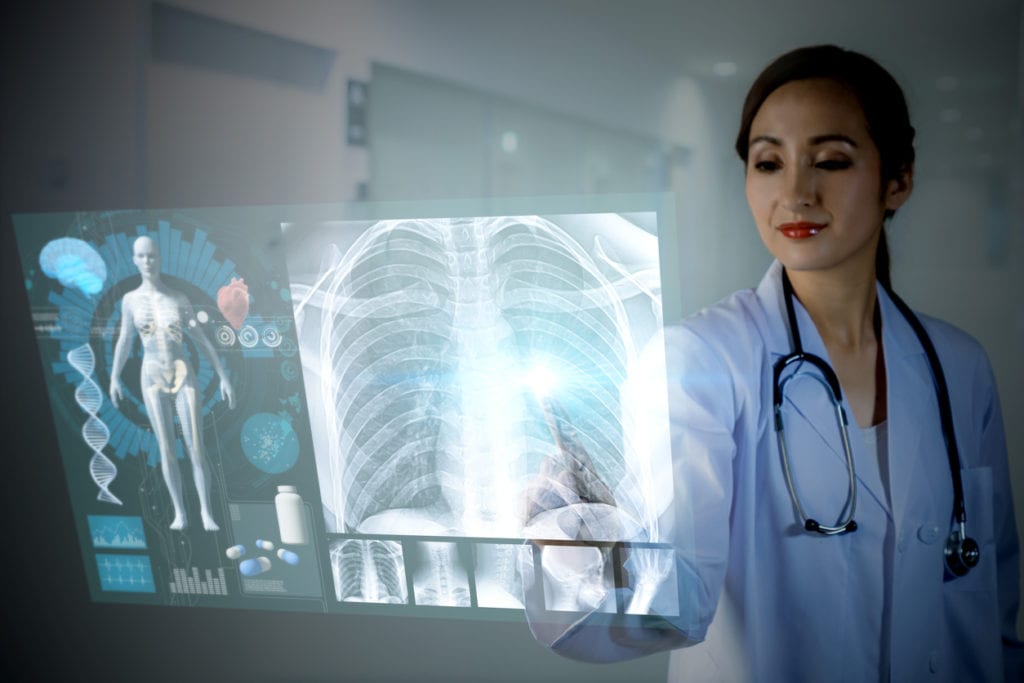 Doctor using medical device software for viewing X-rays